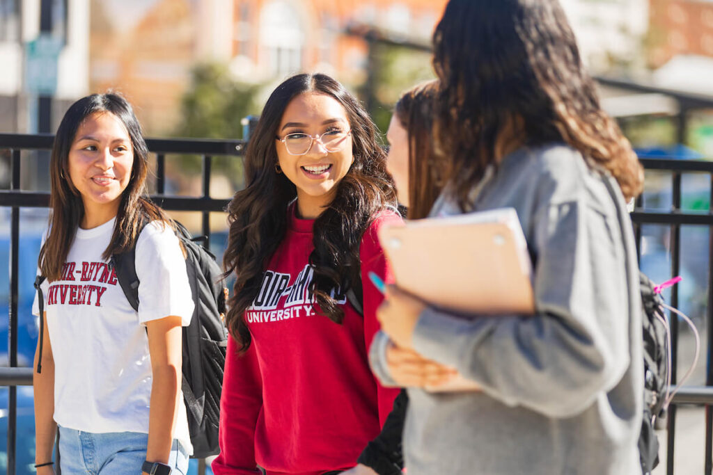 Group of students walking and talking in Hickory along City Walk