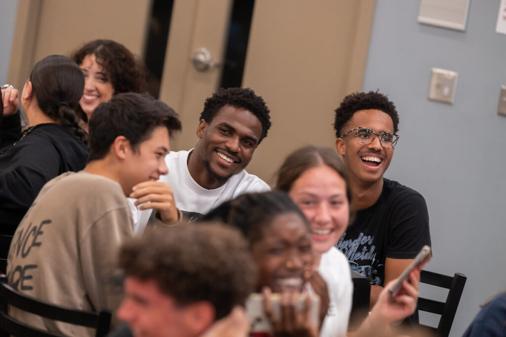 Group of students in dining hall having fun during student life event